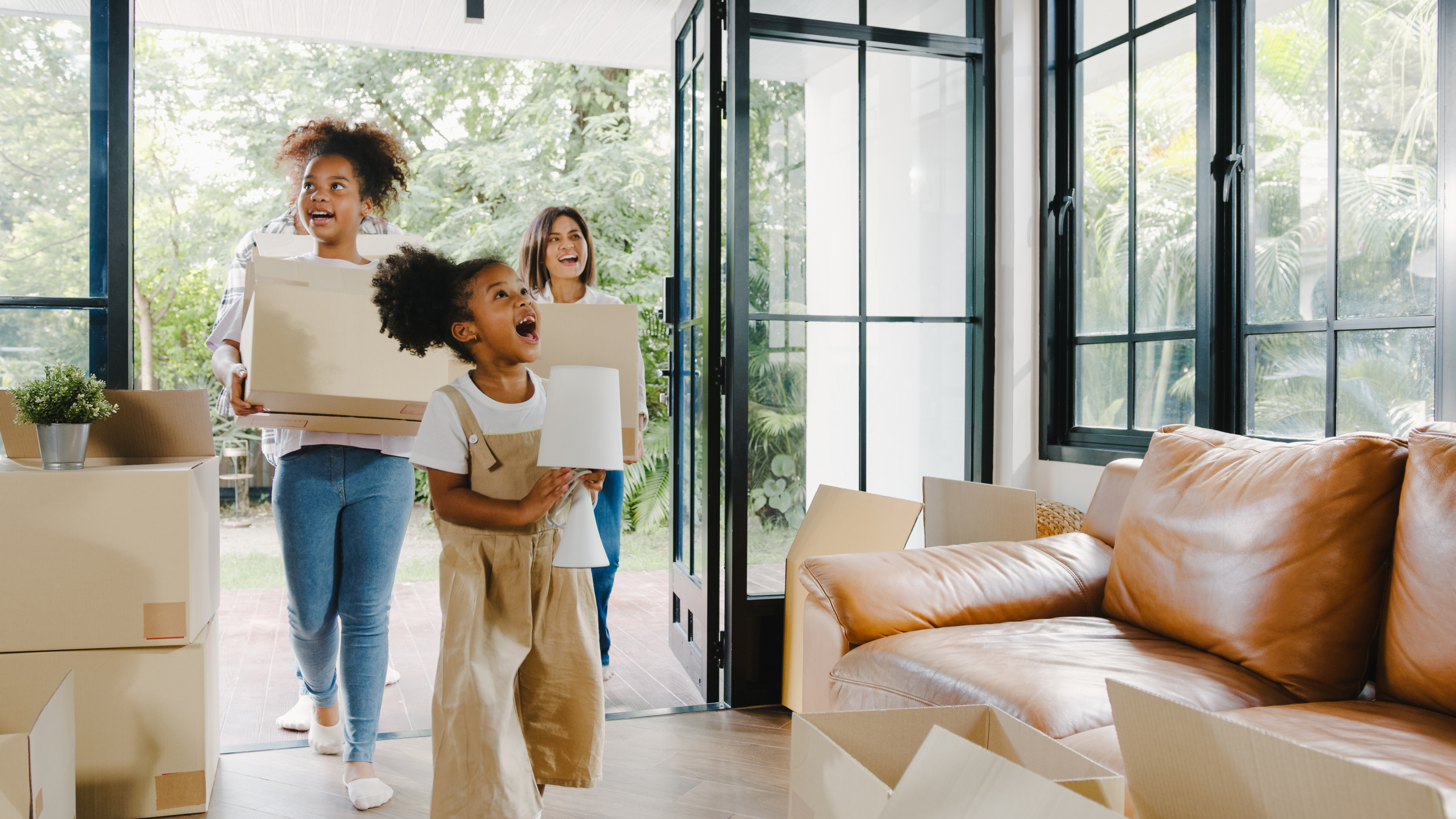 Happy African American Young Family Bought New House. Mom, Dad,