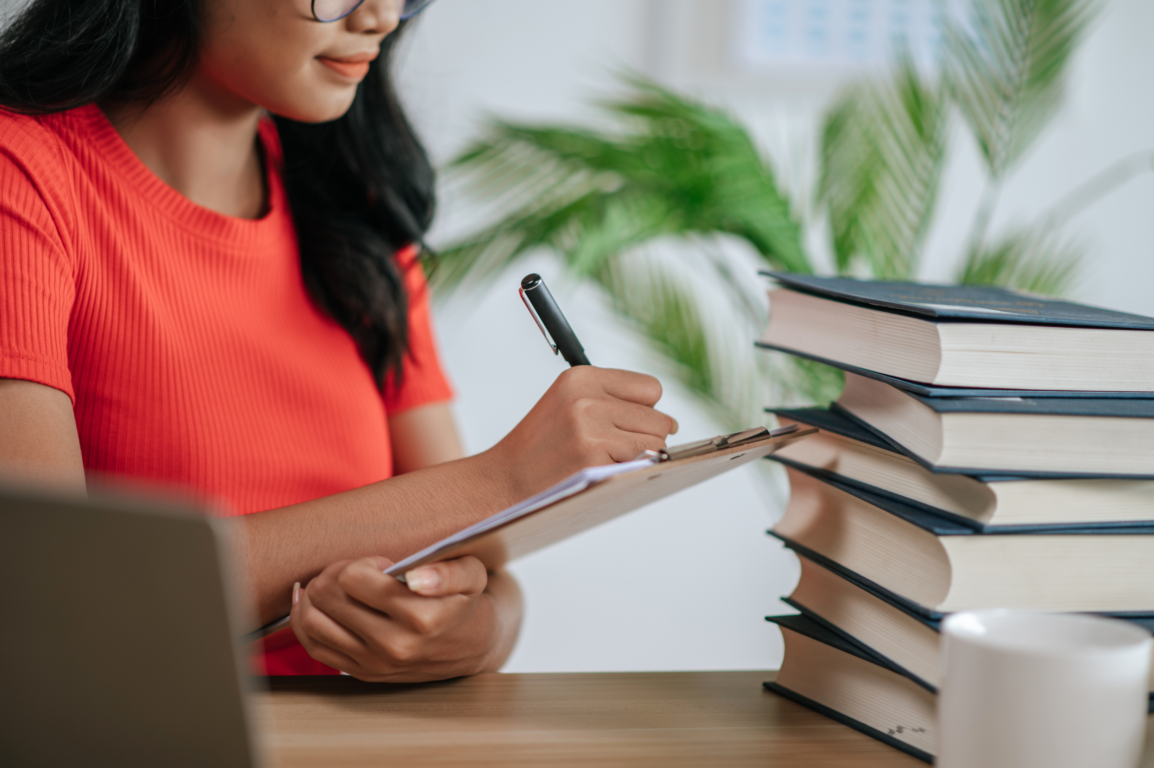 Woman Holding Checklist In Office